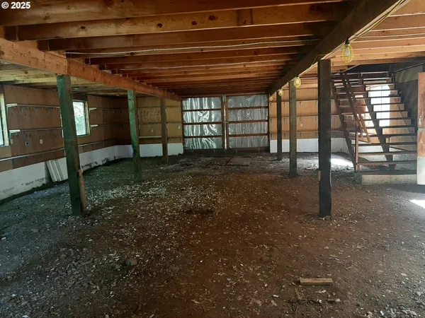 a view of a room with wooden walls