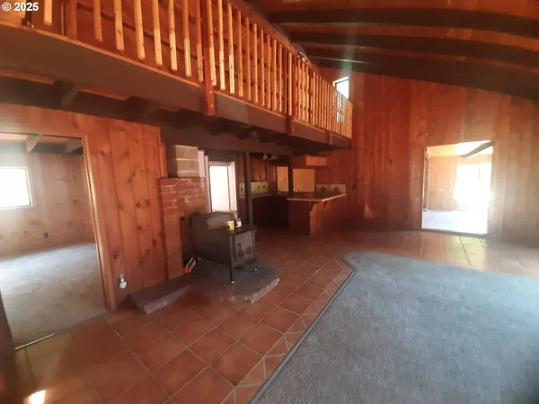 a view of livingroom with furniture and a window