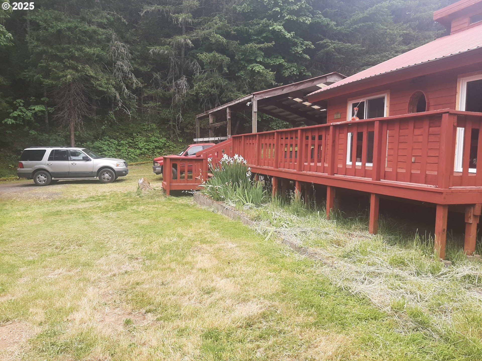 252 May Creek Road Days Creek, OR 97429 - Photo 2 of 35 a view of a house with pool and chairs