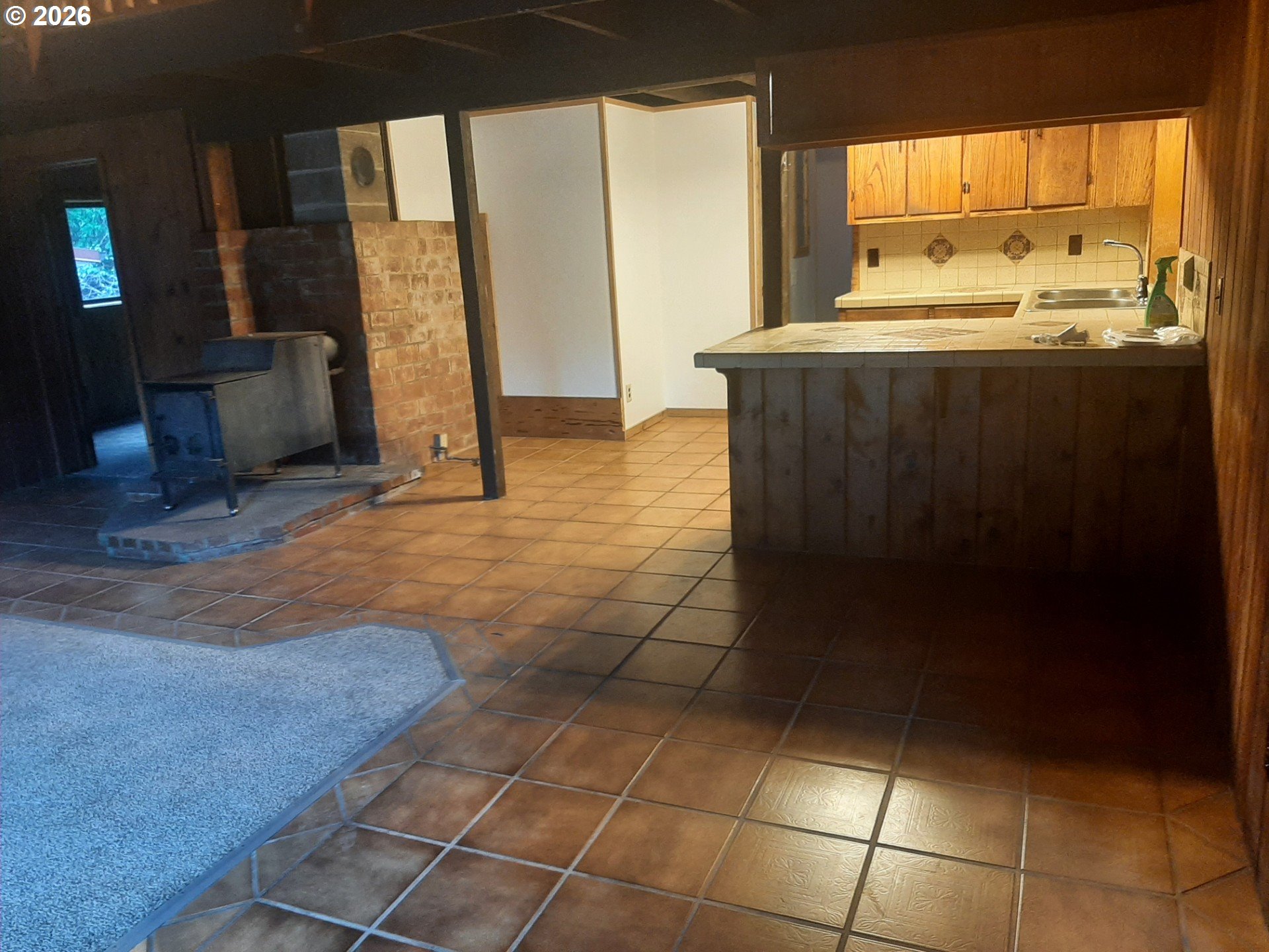 252 May Creek Road Days Creek, OR 97429 - Photo 33 of 35 a view of open kitchen with granite countertop a sink and a stove