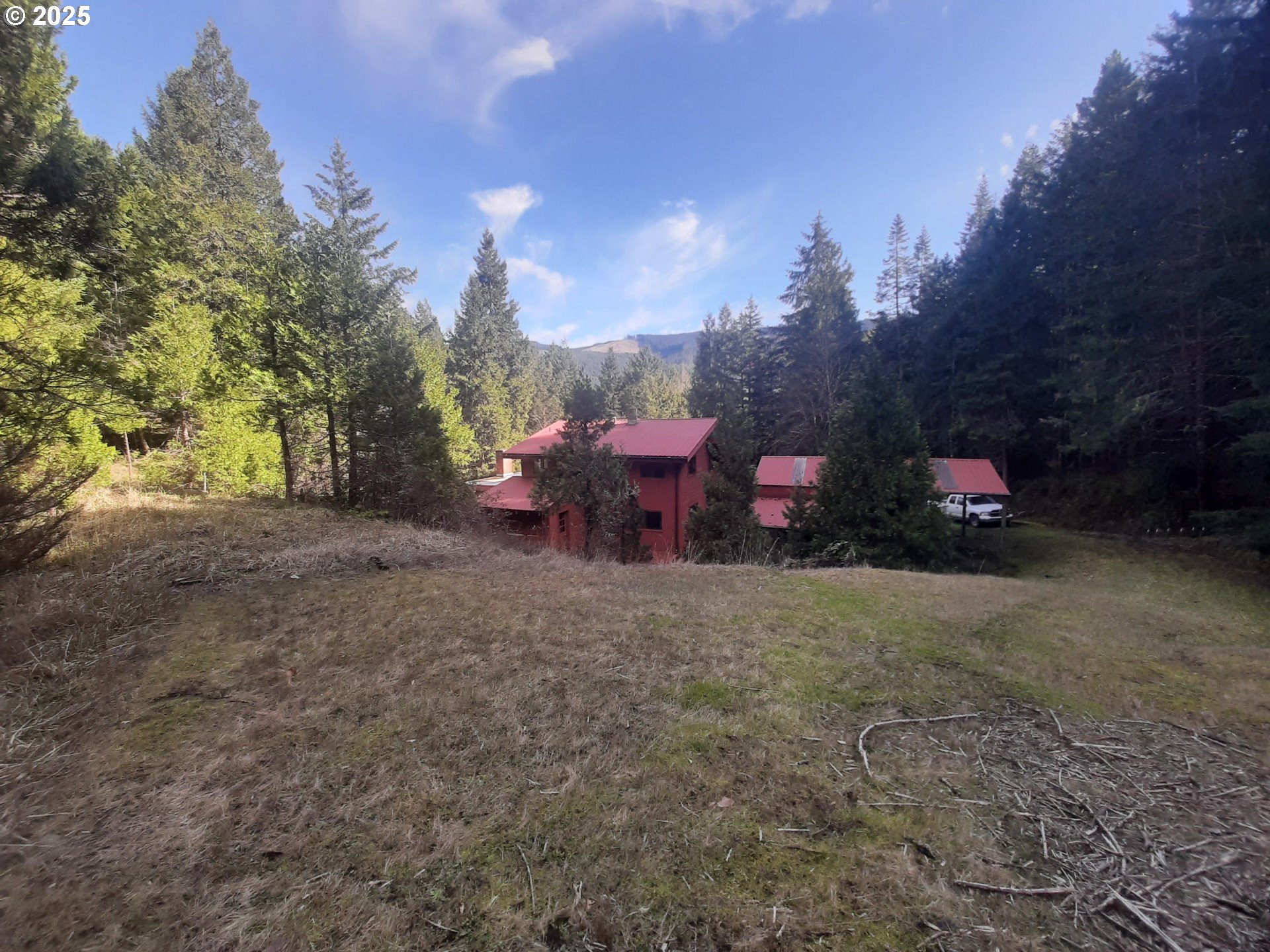 252 May Creek Road Days Creek, OR 97429 - Photo 10 of 35 a backyard of a house with table and chairs