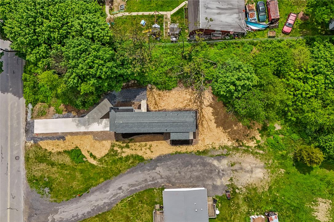 624 Main Road Lehighton, PA 18235 - Photo 42 of 42 An aerial perspective reveals a private residential setting nestled among mature trees, with a winding driveway and ample green space.