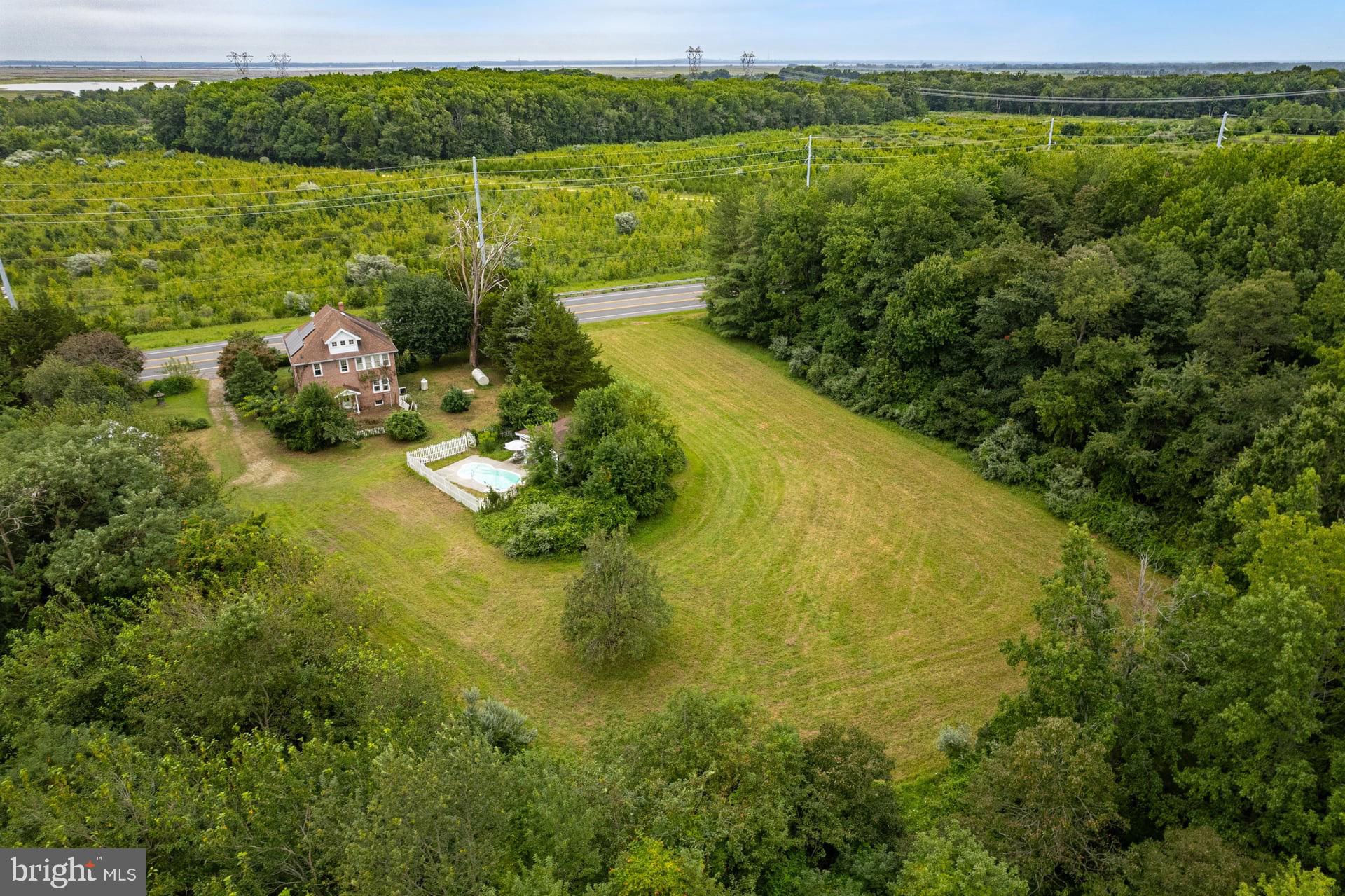 179 Alloway Creek Neck Road Salem, NJ 08079 - Photo 4 of 9 a view of a lake with a houses