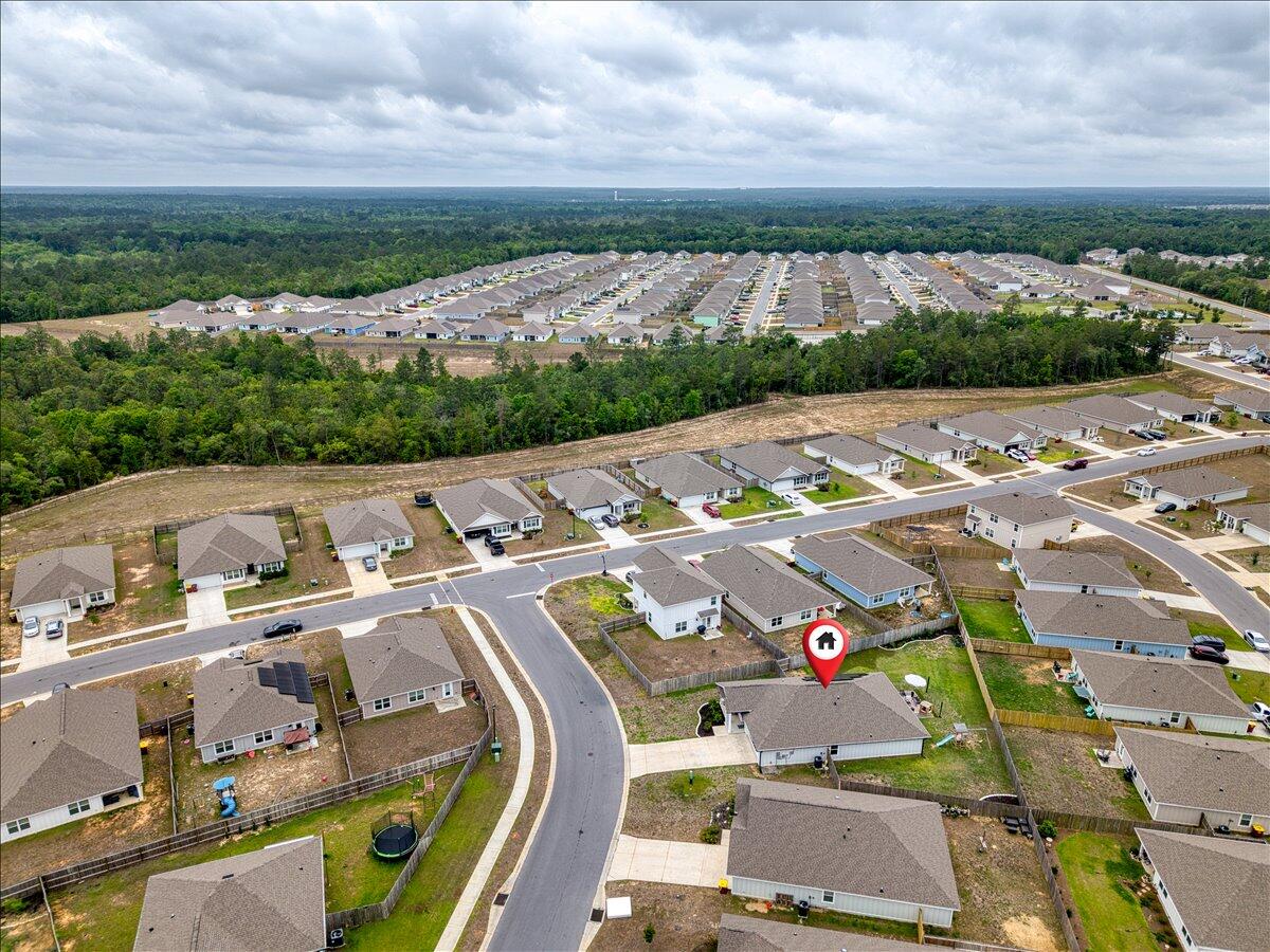 943 Sandbar Loop Crestview, FL 32539 - Photo 58 of 59 an aerial view of a city with lots of residential buildings