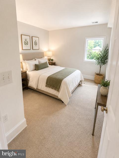 241 Edwards Ferry Road Northeast Leesburg, VA 20176 - Photo 27 of 41 Serene bedroom with natural light.