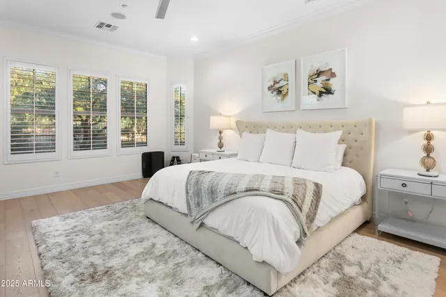 a bedroom with a large bed and a window