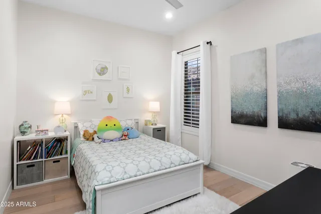 a bedroom with a bed and dresser