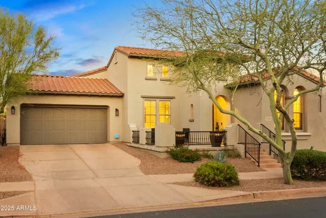 a front view of a house with a garage