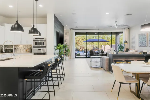 a view of a dining room with furniture window and outside view