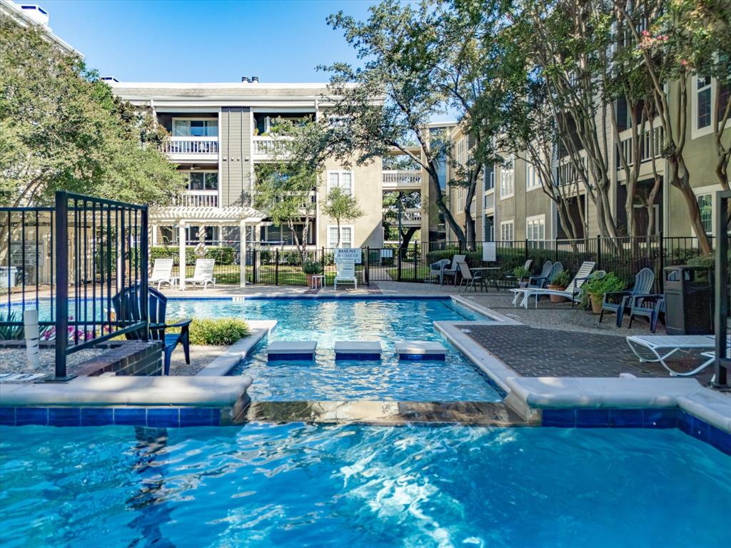 5310 Keller Springs Road, Unit 332 Dallas, TX 75248 - Photo 32 of 39 Community pool featuring a patio area and a hot tub