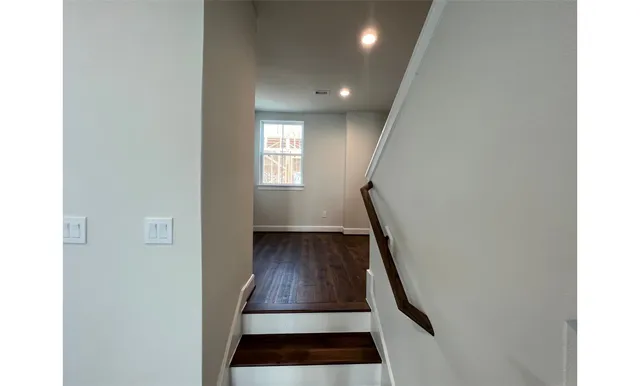 a view of front door with wooden floor