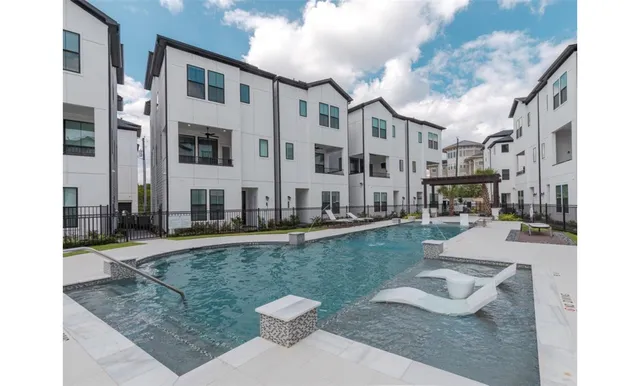 a view of a patio with swimming pool