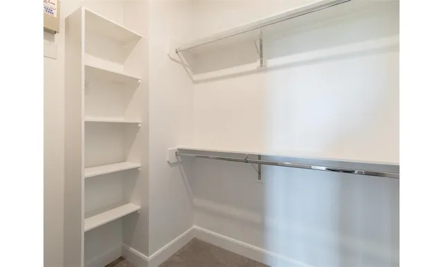a view of an empty walk in closet