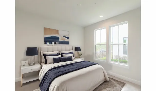 a bedroom with a bed and window