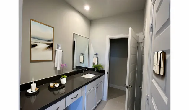 a bathroom with a double vanity sink and mirror