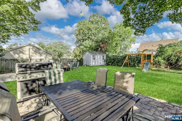 a view of a chairs and table on the patio