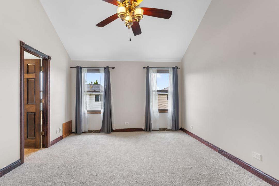 1715 Chestnut Hill Road Plainfield, IL 60586 - Photo 12 of 16 an empty room with closet and a chandelier fan