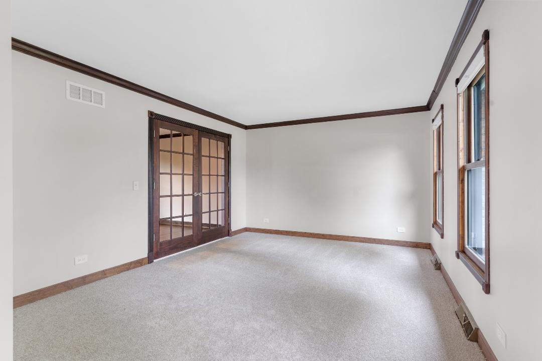 1715 Chestnut Hill Road Plainfield, IL 60586 - Photo 4 of 16 a view of an empty room with a window