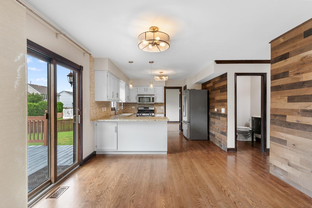 1715 Chestnut Hill Road Plainfield, IL 60586 - Photo 8 of 16 a kitchen with a refrigerator and a stove