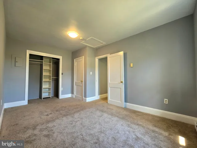a kitchen with stainless steel appliances granite countertop a refrigerator and a stove