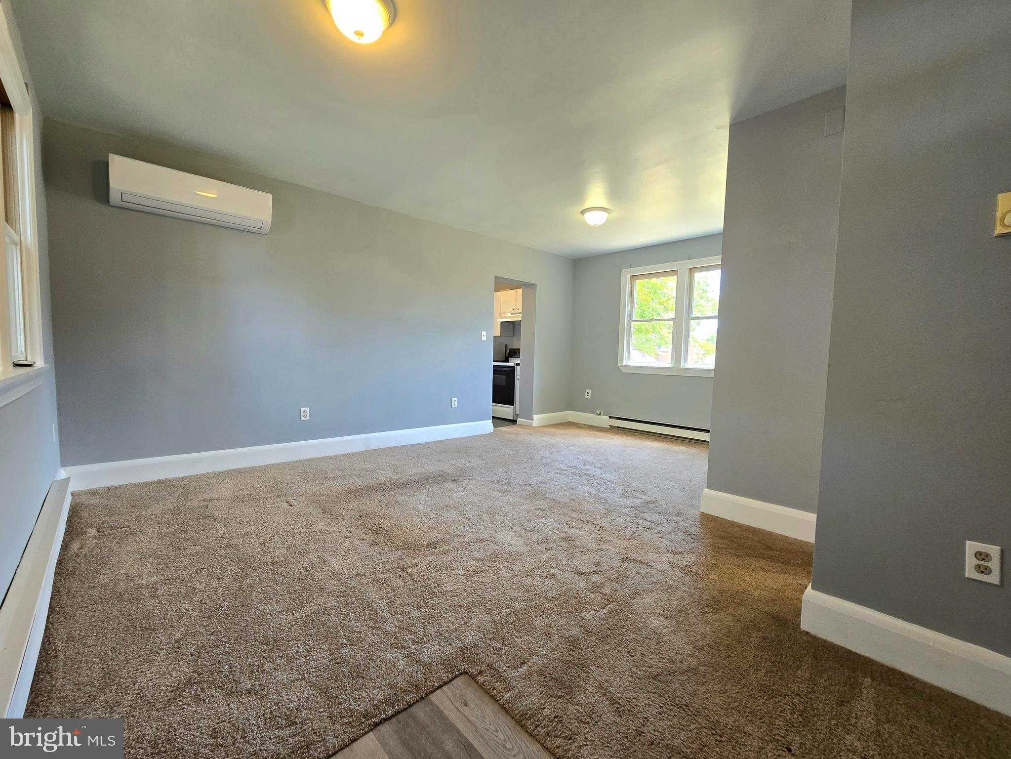 151 Riviera Drive Pasadena, MD 21122 - Photo 35 of 72 an empty room with windows and entrance