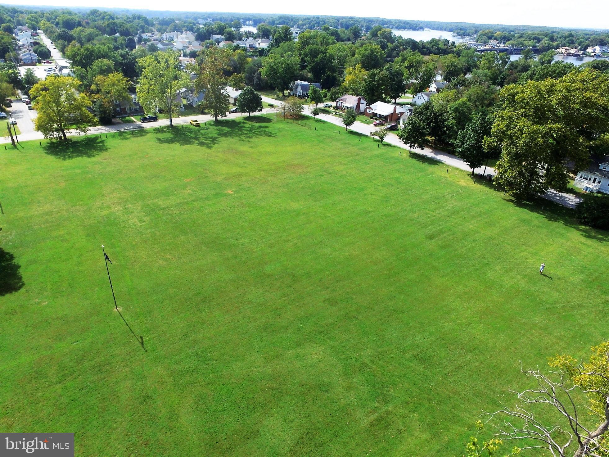 151 Riviera Drive Pasadena, MD 21122 - Photo 64 of 72 a view of a golf course with chairs