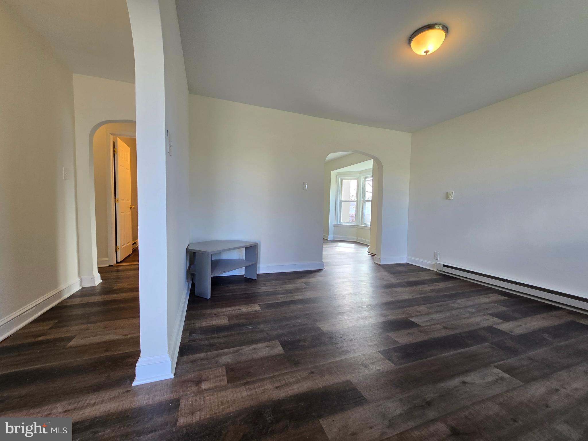 151 Riviera Drive Pasadena, MD 21122 - Photo 9 of 66 a view of a livingroom with wooden floor and a window