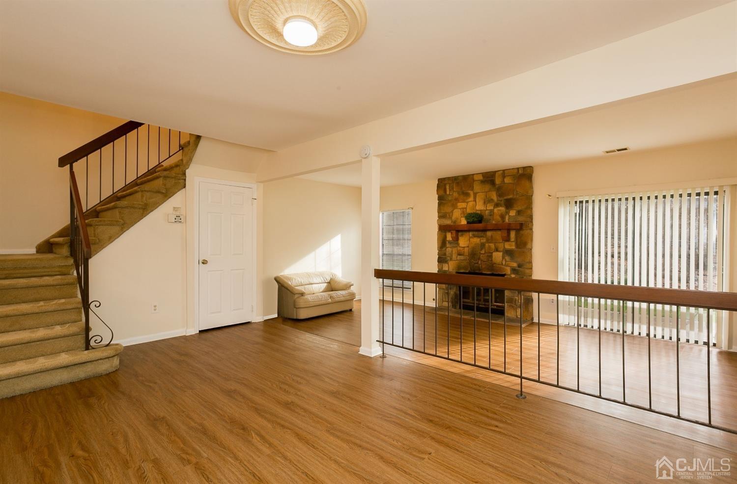 1307 Timber Oaks Road Edison, NJ 08820 - Photo 13 of 26 a view of empty room with wooden floor