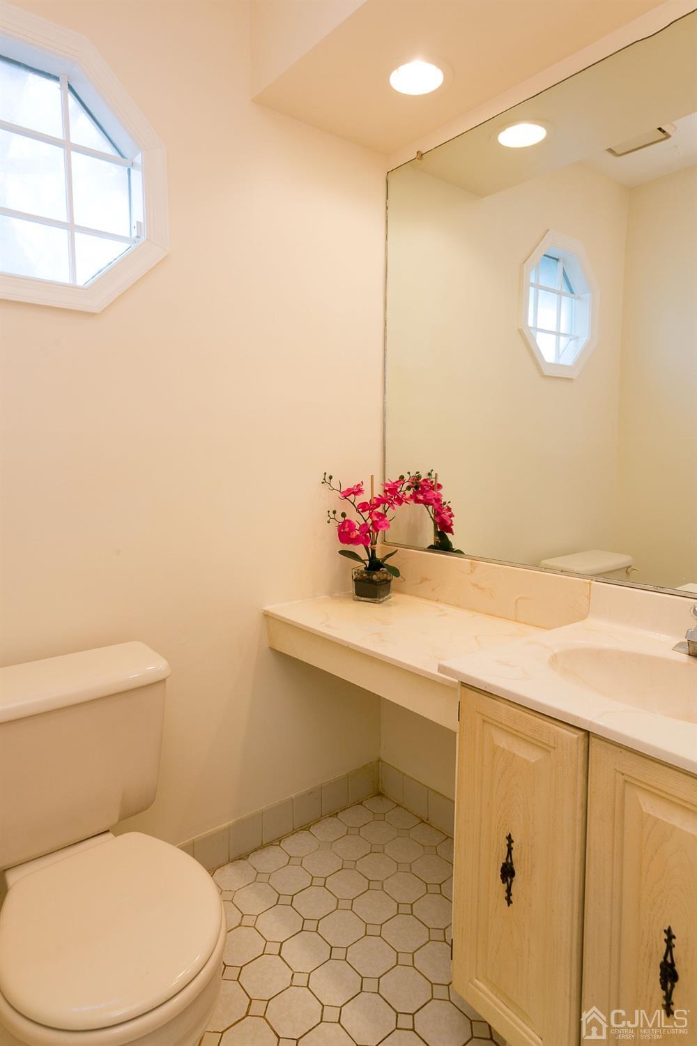 1307 Timber Oaks Road Edison, NJ 08820 - Photo 16 of 26 a bathroom with a sink mirror vanity and toilet