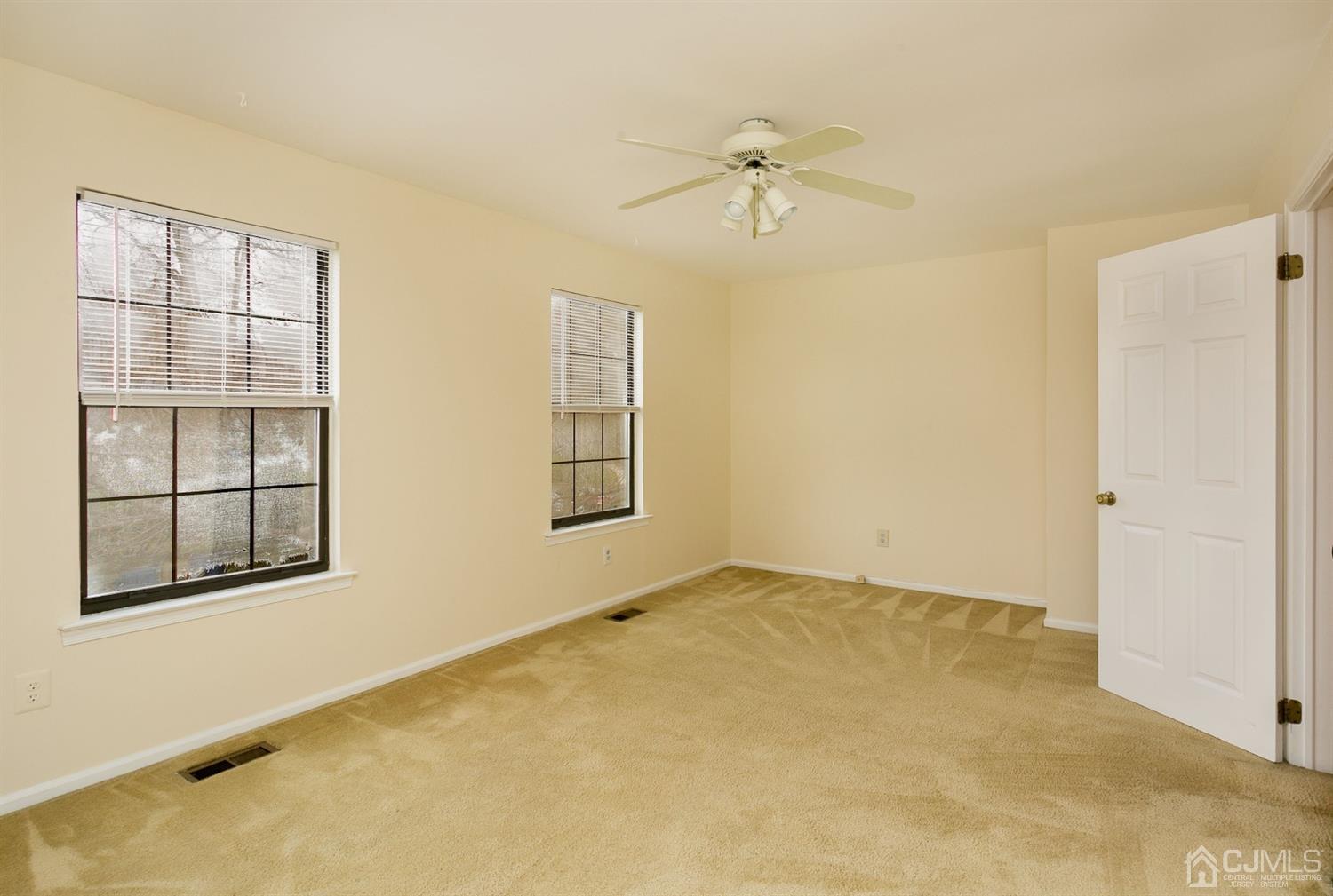 1307 Timber Oaks Road Edison, NJ 08820 - Photo 21 of 26 an empty room with windows and closet