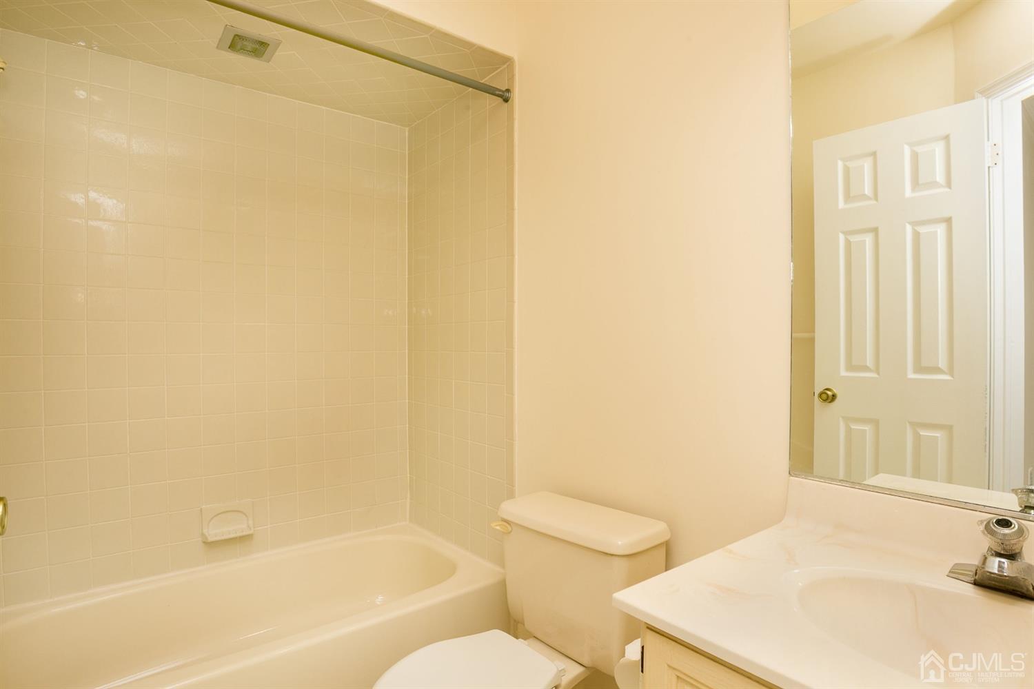 1307 Timber Oaks Road Edison, NJ 08820 - Photo 24 of 26 a bathroom with a sink and a mirror