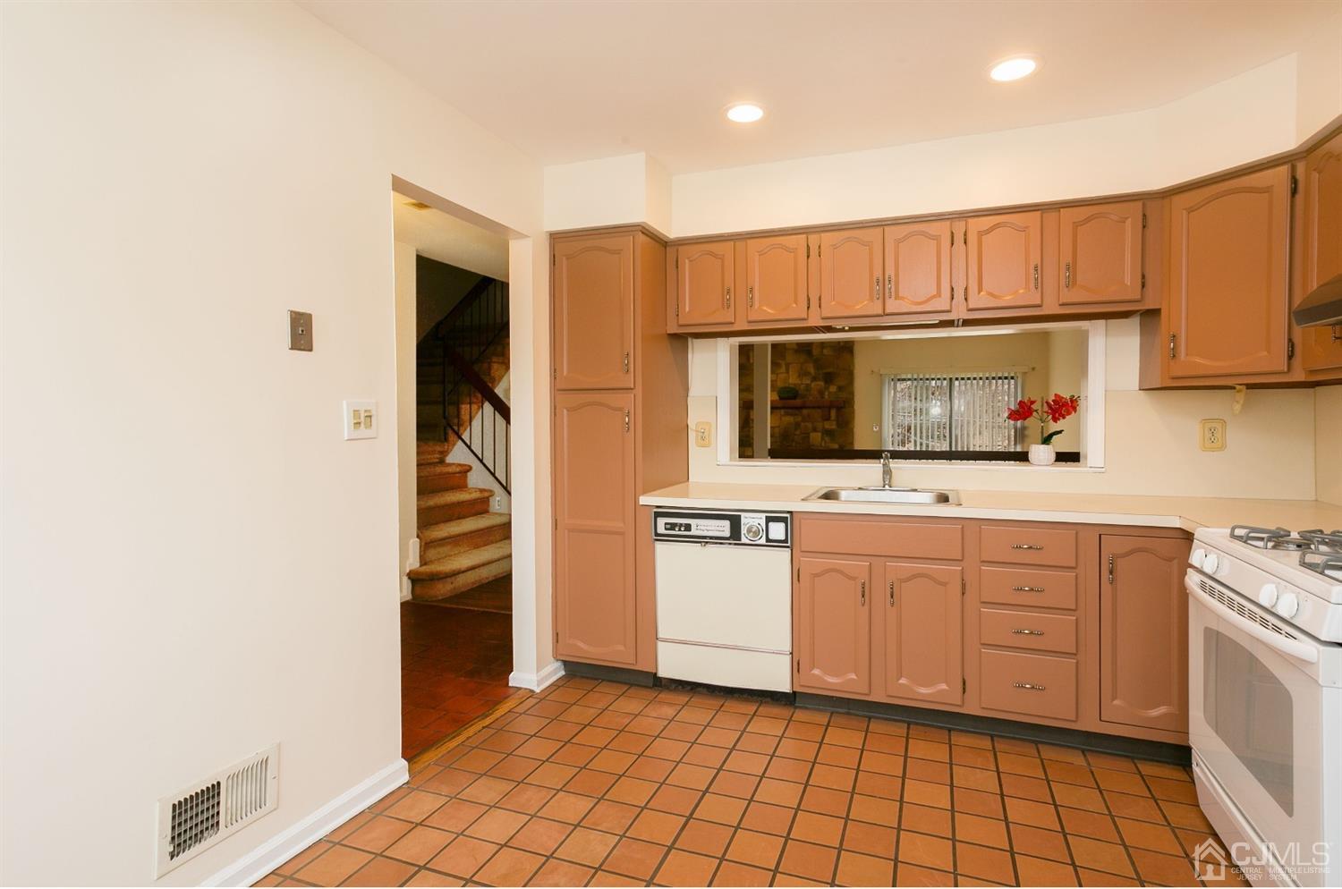 1307 Timber Oaks Road Edison, NJ 08820 - Photo 10 of 26 a kitchen with stainless steel appliances a refrigerator and cabinets