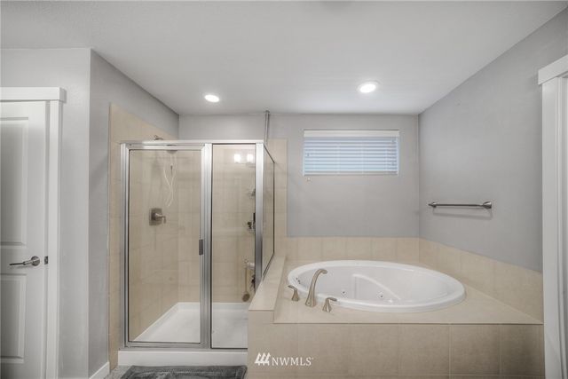 an empty room with windows and white walls