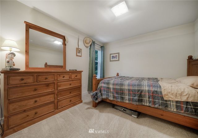 a spacious bathroom with a granite countertop sink a mirror and a