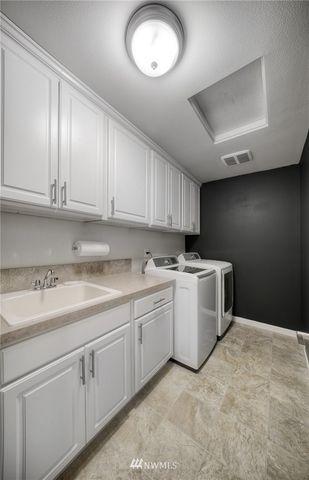 a outdoor space with patio furniture and a fireplace