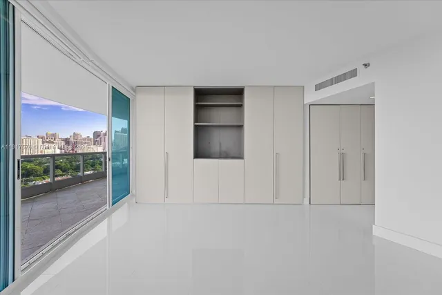 wooden floor and window in an empty room