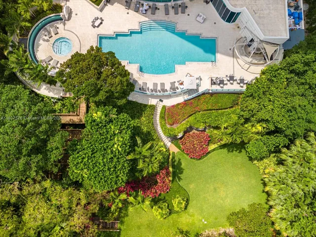 an aerial view of a house with swimming pool and outdoor space
