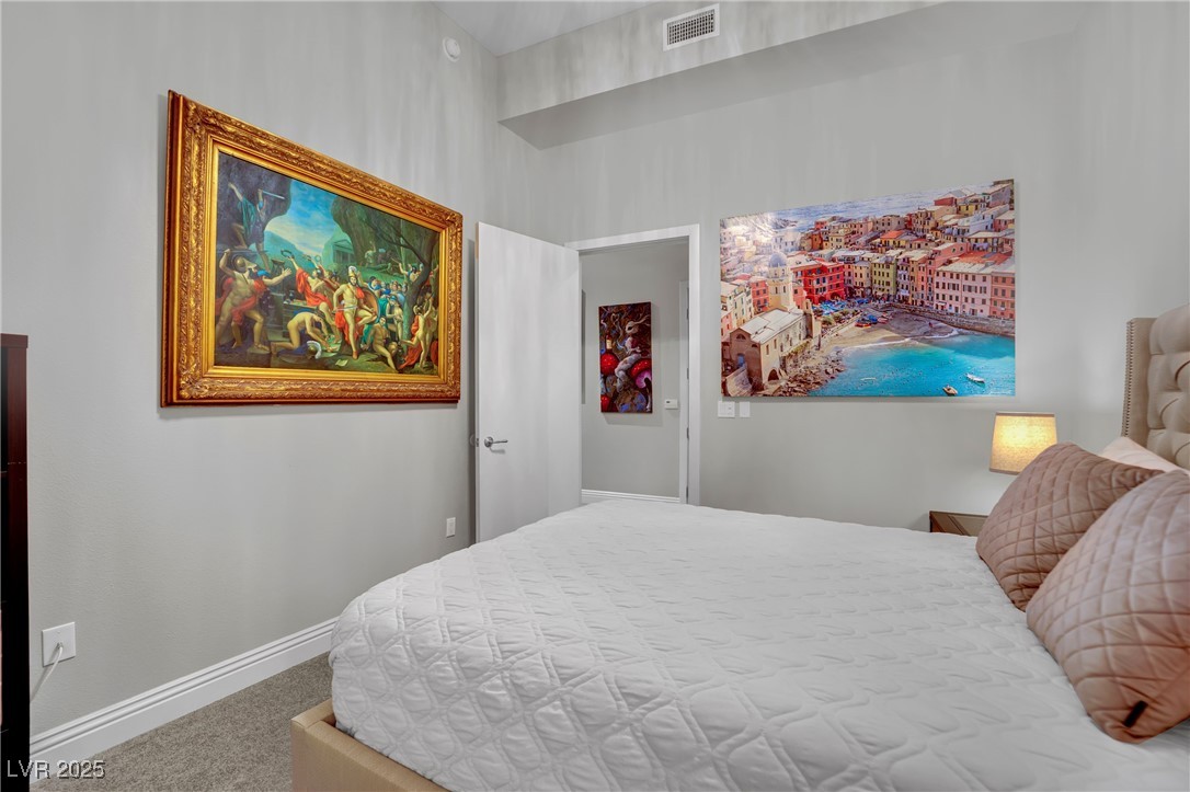 360 East Desert Inn Road, Unit 1803 Las Vegas, NV 89109 - Photo 20 of 67 Bedroom featuring carpet floors and baseboards