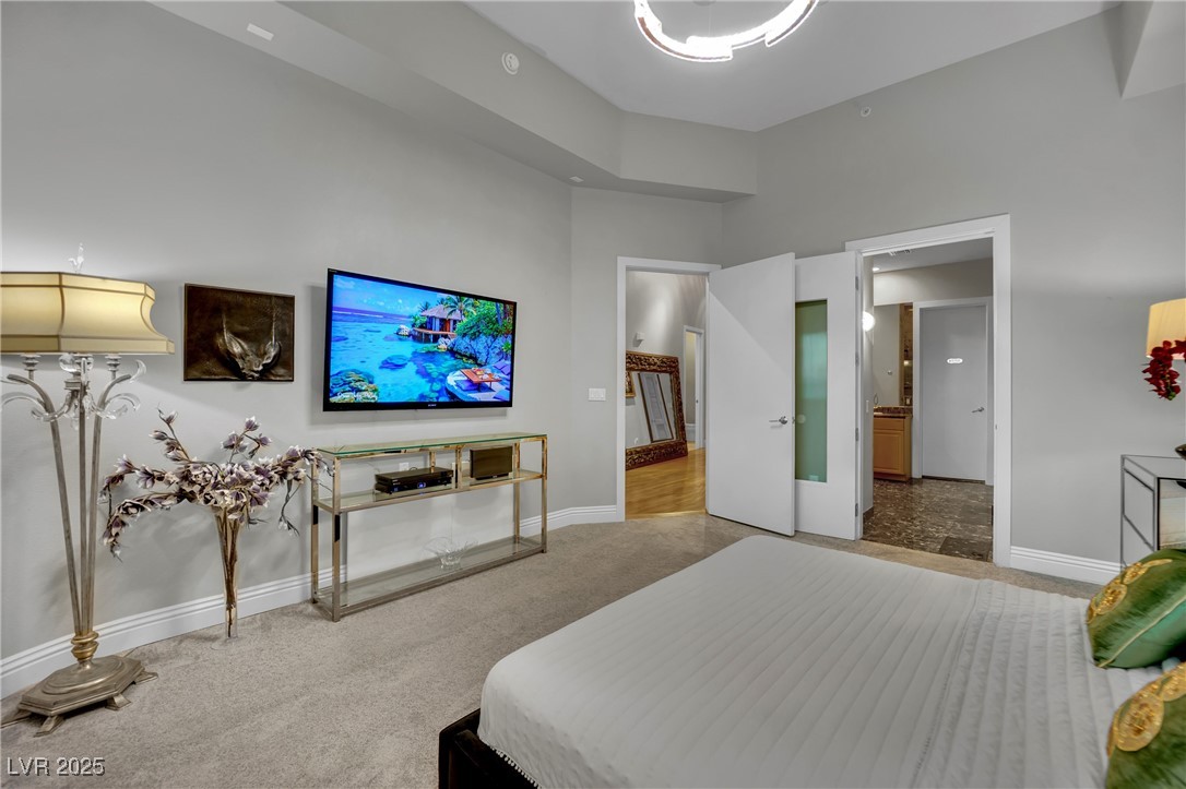 360 East Desert Inn Road, Unit 1803 Las Vegas, NV 89109 - Photo 29 of 67 Carpeted bedroom with baseboards