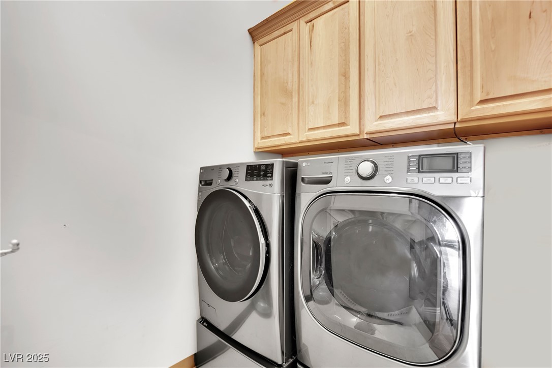 360 East Desert Inn Road, Unit 1803 Las Vegas, NV 89109 - Photo 53 of 67 Laundry area with cabinet space and washer and clothes dryer