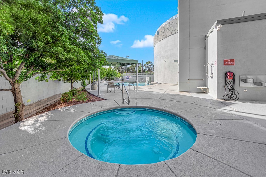 360 East Desert Inn Road, Unit 1803 Las Vegas, NV 89109 - Photo 61 of 67 Community pool with a patio area