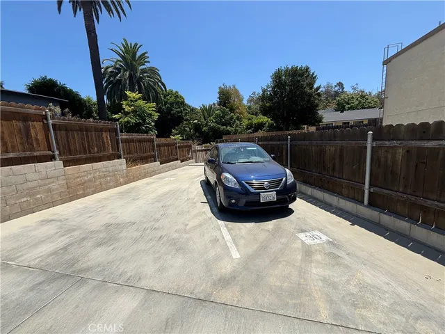a view of a backyard with couches