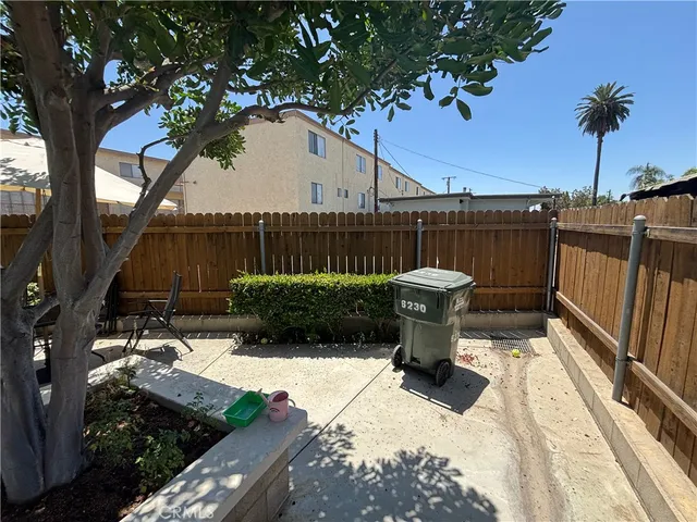a view of a chair and table in the patio
