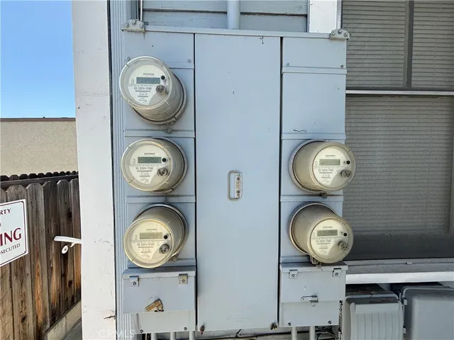 a view of a storage and utility room with wooden wall