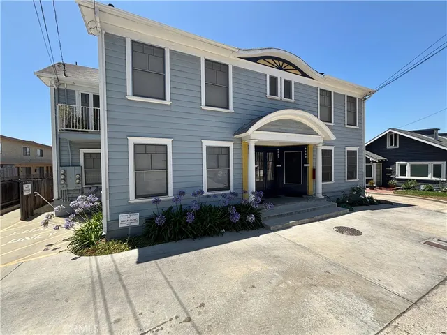 a front view of a house with yard