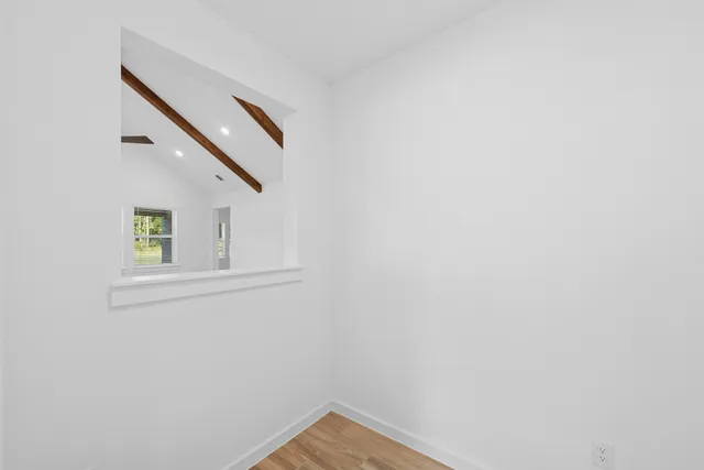 a bathroom with a sink mirror toilet and bathtub