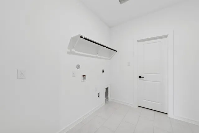 a view of staircase with white walls and window