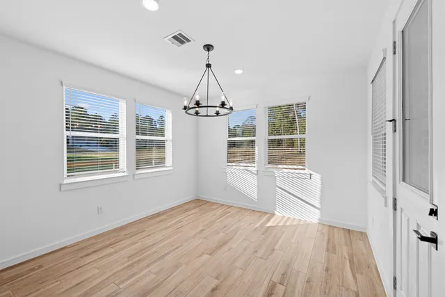a kitchen with kitchen island a sink appliances and cabinets