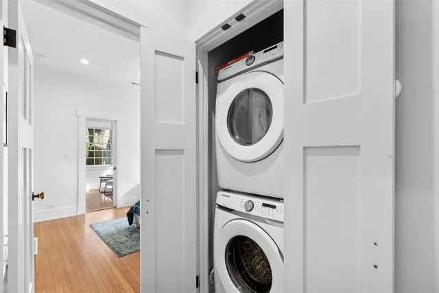 a view of a hallway with washer and dryer