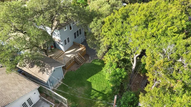 a backyard of a house with lots of green space